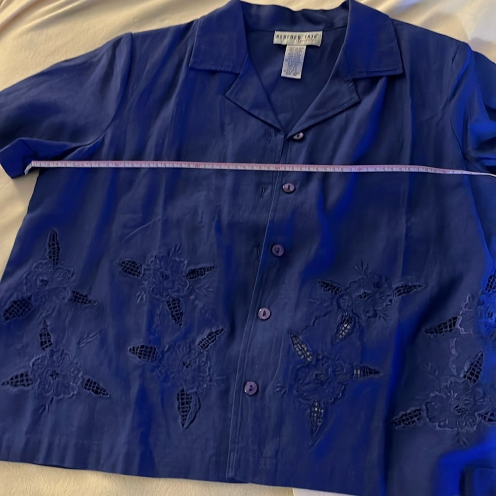 Blue button down blouse.